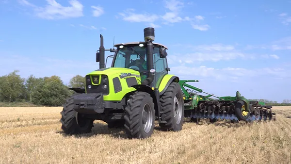 Wheeled Tractor PL2304 working in the fields of Satpayev, Kazakhstan