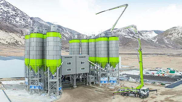 Truck mixers and concrete batching plant at the Bloongan Industrial Park Project in North Kalimantan, Indonesia, visited by the Indonesian President