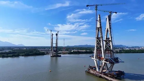 Tower cranes supporting Sejingkat Bridge construction in Malaysia